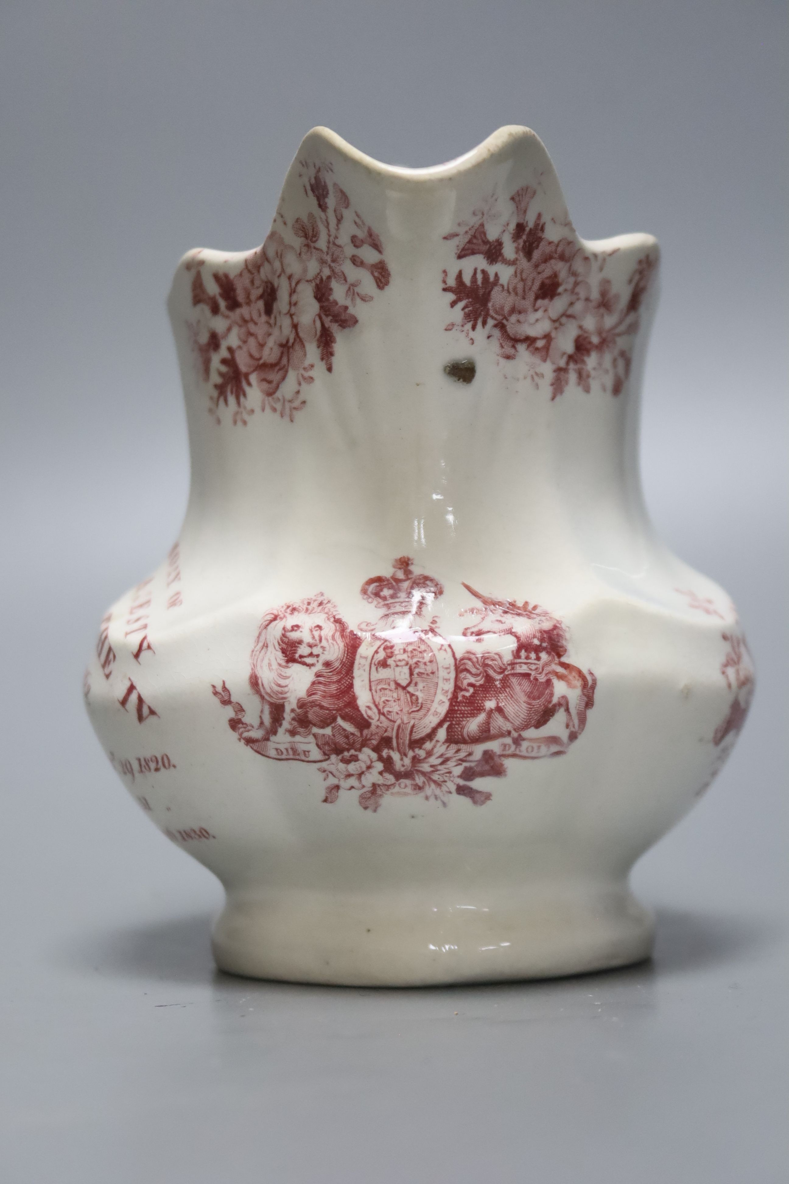 A George IV commemorative pottery jug, 14cm tall